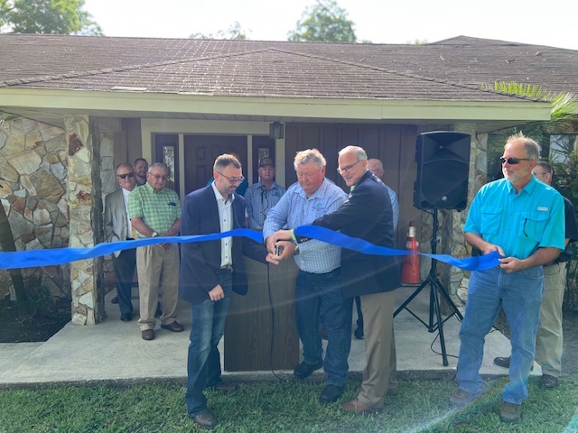 Ribbon cutting ceremony at a residential home.