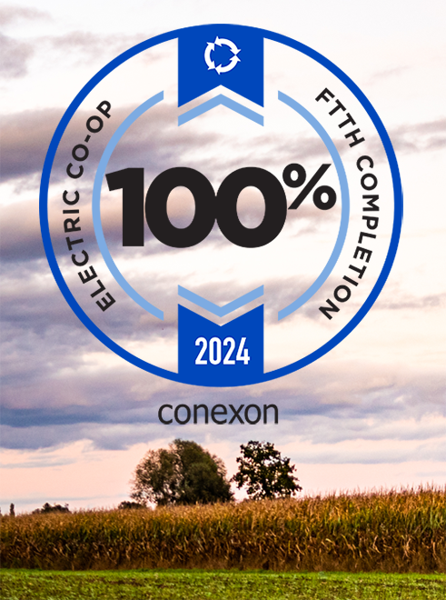 A corn field at sunset with the Conexon 100% Connect 2024 club badge overtop.