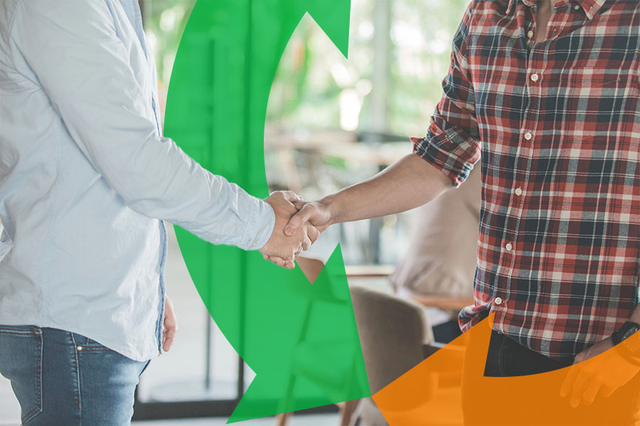 Two men stand and shake hands in an office with a Conexon icon floating around for thumbnail.