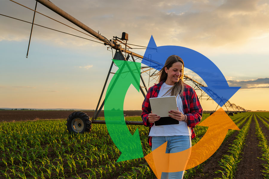 Woman smiles and holds her tablet while walking past smart irrigation machine with Conexon icon behind her for thumbnail.