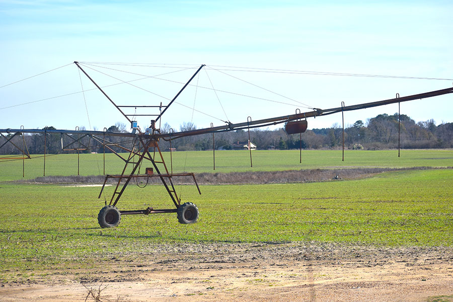 Irrigation setup over a rural farm field.