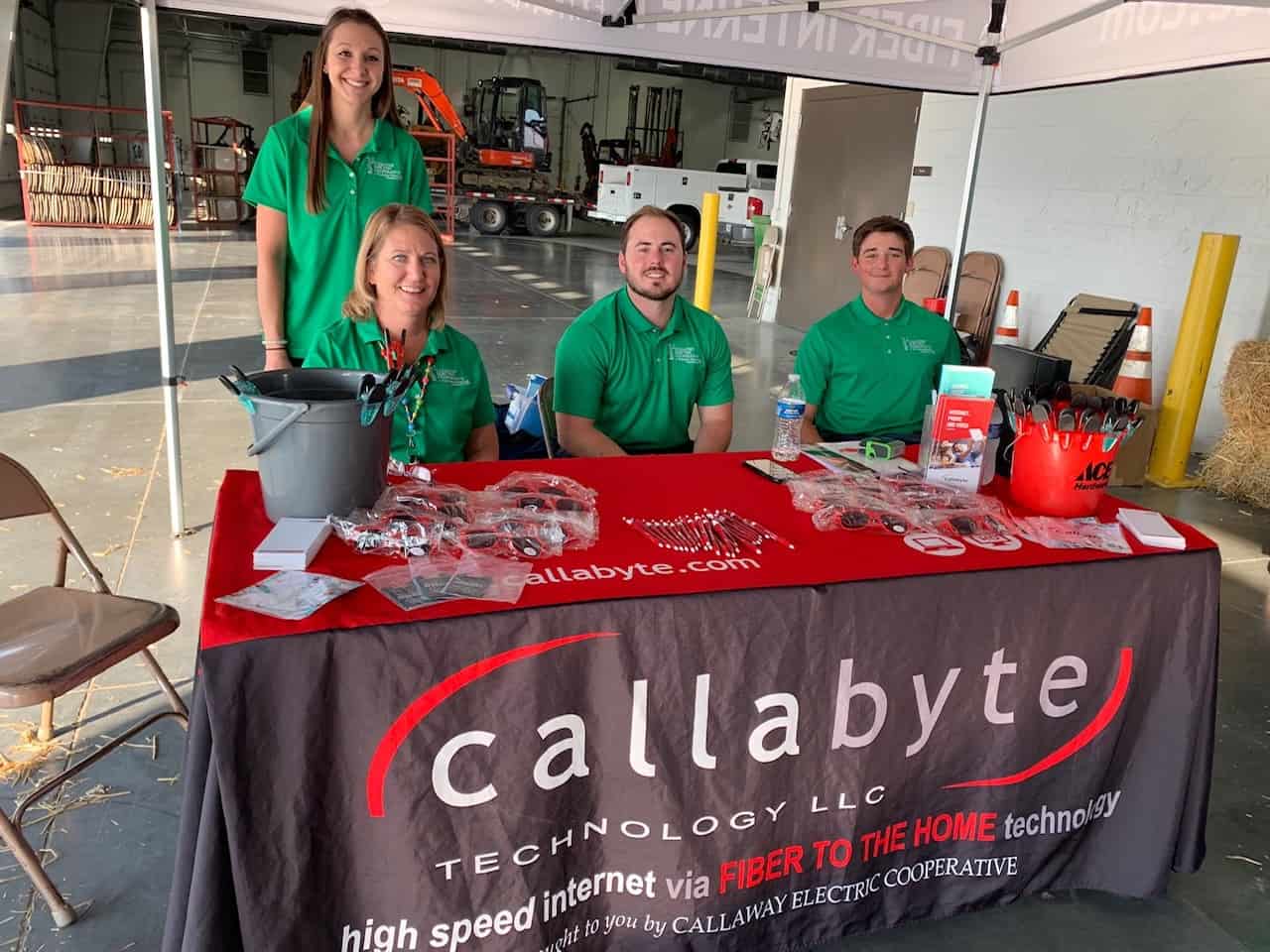 A Callabyte pop-up booth with employees sitting at it.